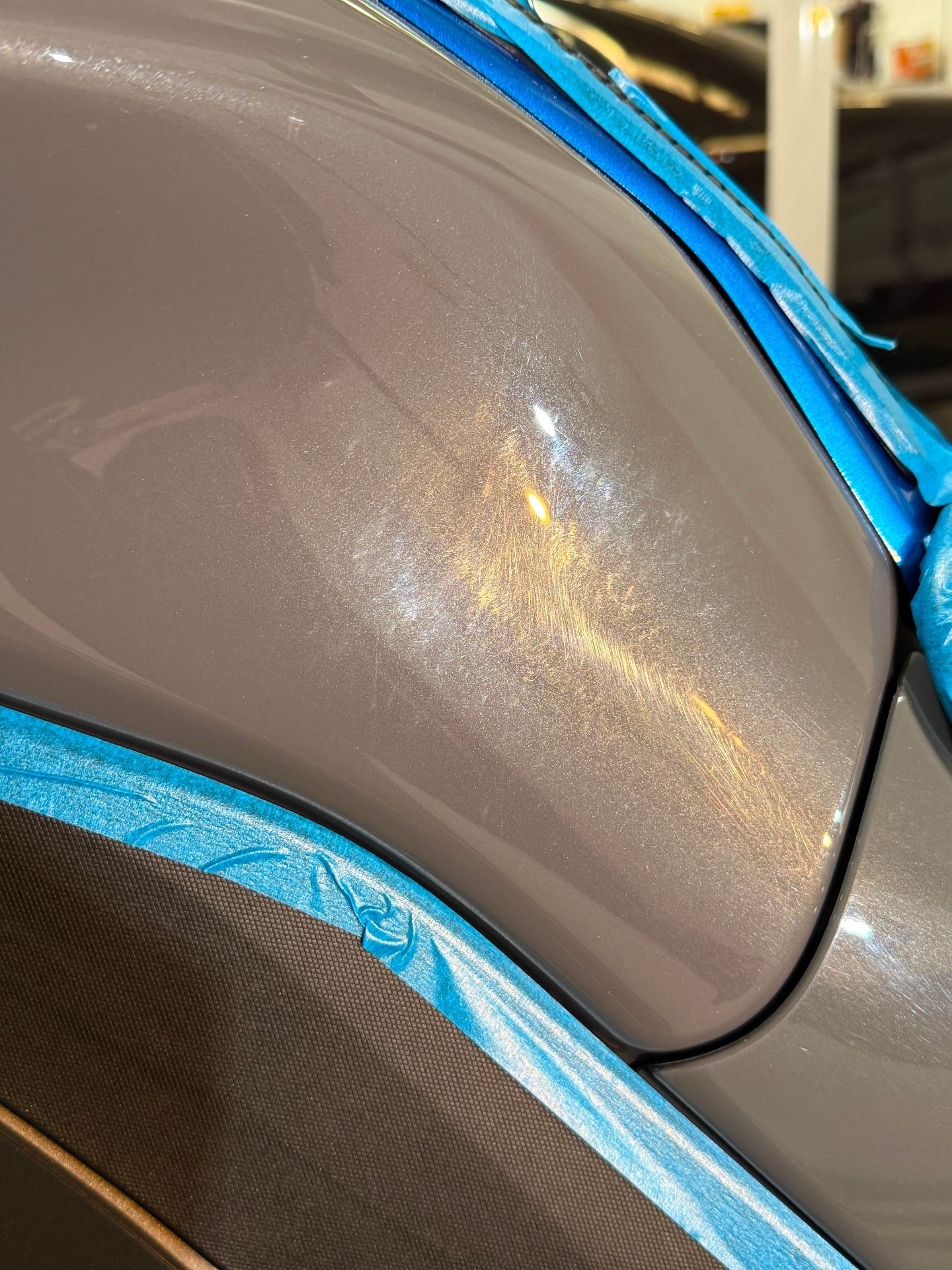 Motorcycle paint showing swirl marks before correction